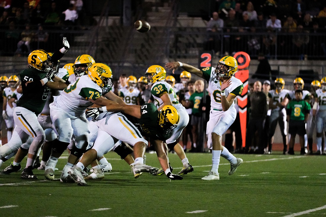 Lynden sophomore quarterback Brant Heppner throws the ball at Civic Stadium on Sept. 30. The Lions beat Sehome 21-19.