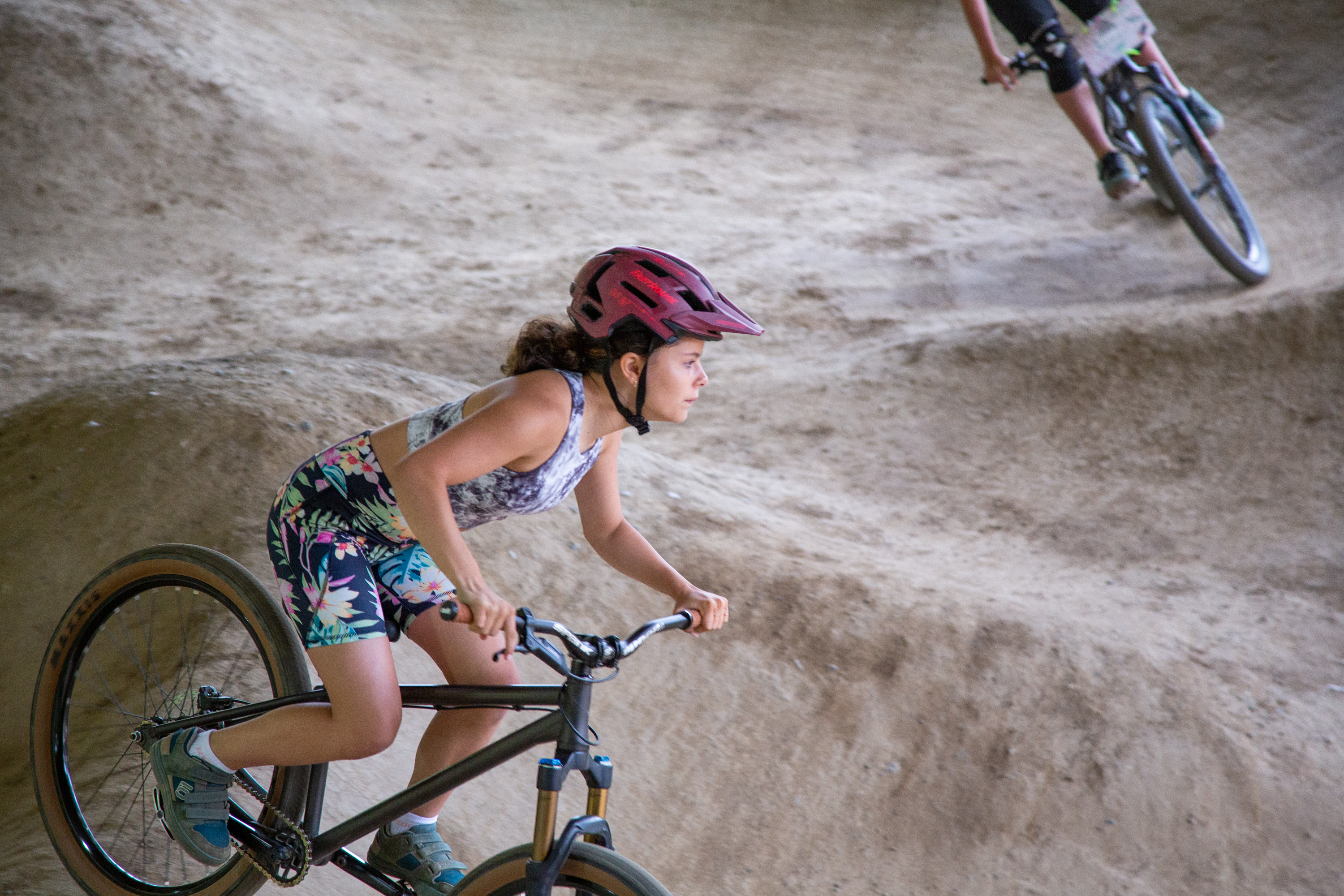 Part III: The Radical Rippers wind through the pump track at the Bike Ranch in Bellingham this summer. The young female-identifying and nonbinary riders participated in a three-day camp to learn mountain biking basics.