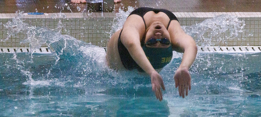 Sehome’s Luna Lee launches herself into the pool to swim the backstroke for the 200-yard medley relay as the Mariners took on Oak Harbor in a swim meet at Arne Hanna Aquatic Center on Oct. 21.
