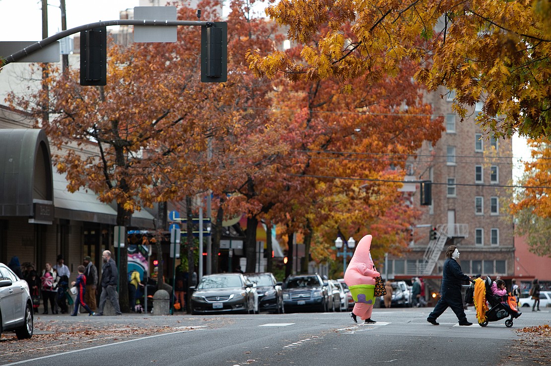 Patrick Star and Mike Myers psuh a stroller across Magnolia Street.