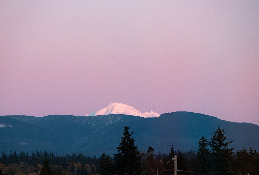 Mount Baker glows pink at sunset at 4:45 p.m. on Nov. 8. The end of Daylight Saving Time means the beginning of before-5 p.m. sunsets.