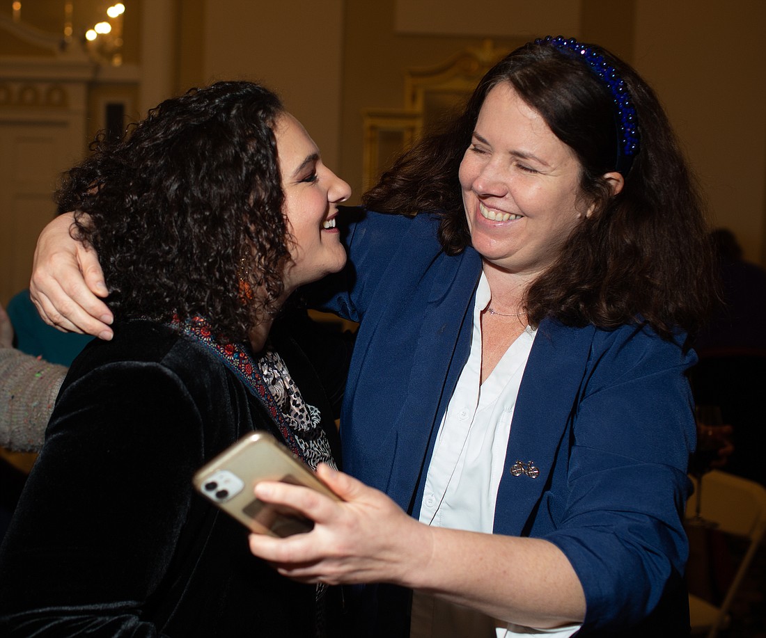 Jaime Arnett, left, and Rep. Sharon Shewmake hug after receiving election results at Hotel Leo on Nov. 8. Arnett led in the race for Public Utility District No. 1 commissioner.