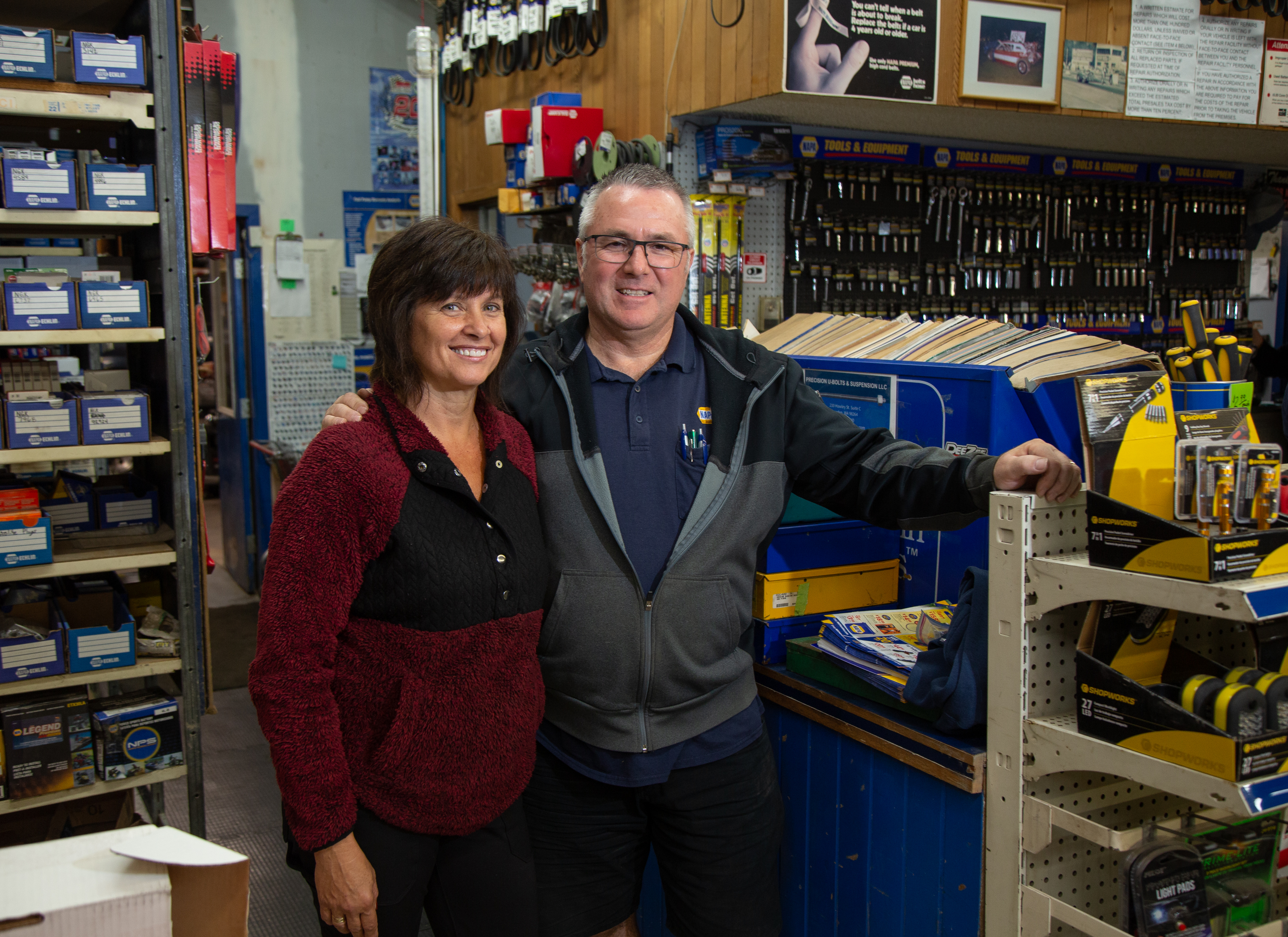 Part IV: Owners Kaylene and BJ Edwards stand in their Sumas NAPA Auto Parts shop on Nov. 3. Their shop endured severe damage and debris from flooding last fall.