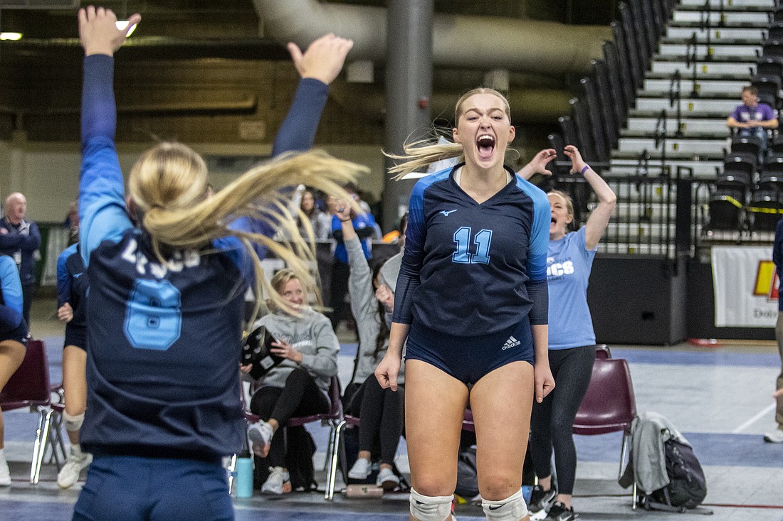 Lynden Christian's Reganne Arnold (11) leaps in joy as the Lyncs defeat Cascade Christian to claim third place at the 1A state volleyball tournament in Yakima on Nov. 12.