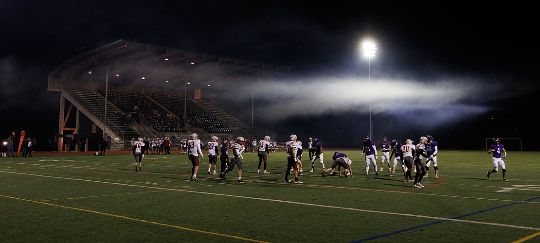 A cloud of fog settles over players as Nooksack Valley and Riverside face off in a playoff game on Saturday, Nov. 12. at Civic Stadium.