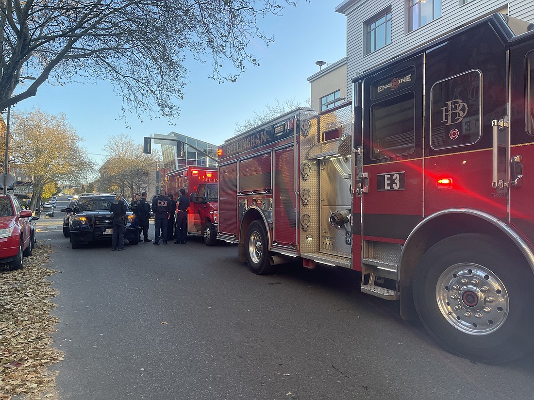 Several police vehicles, an ambulance and a fire truck blocked access to Holly Street in downtown Bellingham Thursday afternoon after a man allegedly attacked several Little Cheerful Cafe employees.