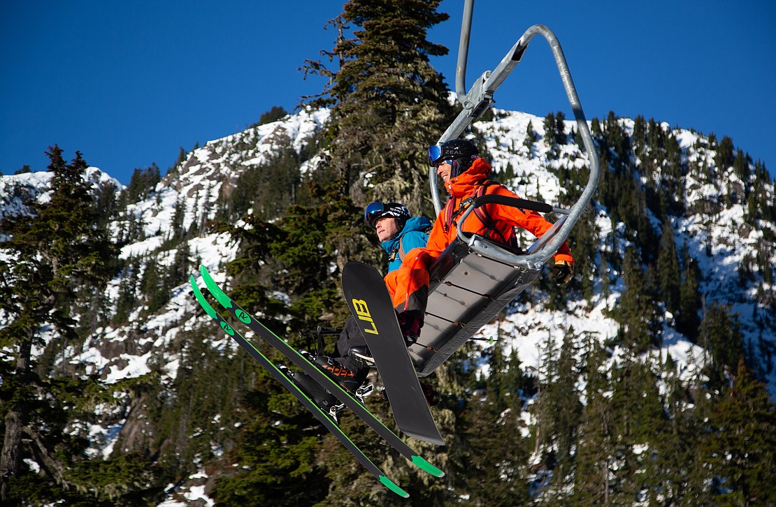Gavin Gillespie, left, and Adam Ü ride the first lift of the morning — and of the season — on Chair 1 at Mount Baker Ski Area on Nov. 18.