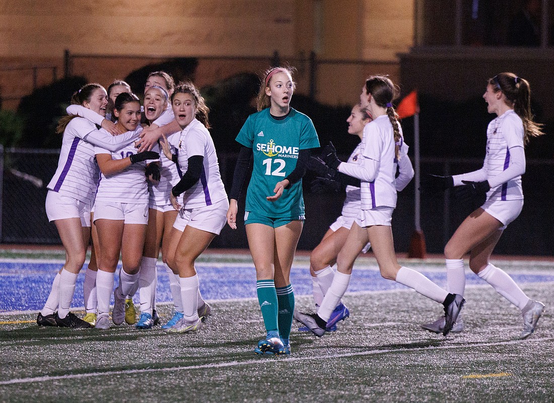 Sehome's Myra Boehm looks stunned as Columbia River celebrates the winning goal in Sehome's 1-0 loss in the 2A girls soccer state championship game at Shoreline Stadium on Nov. 19.