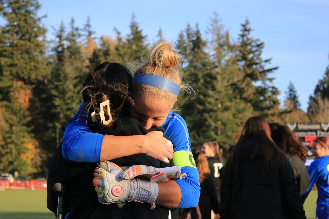 Fifth-year senior goalkeeper Claire Henninger embraces sophomore midfielder Ashley Nguyen following Western’s 3-1 win Saturday, sending to Vikings to the Final Four in Seattle on Dec. 1. Henninger earned another postseason win in the keeper position, tallying four saves.