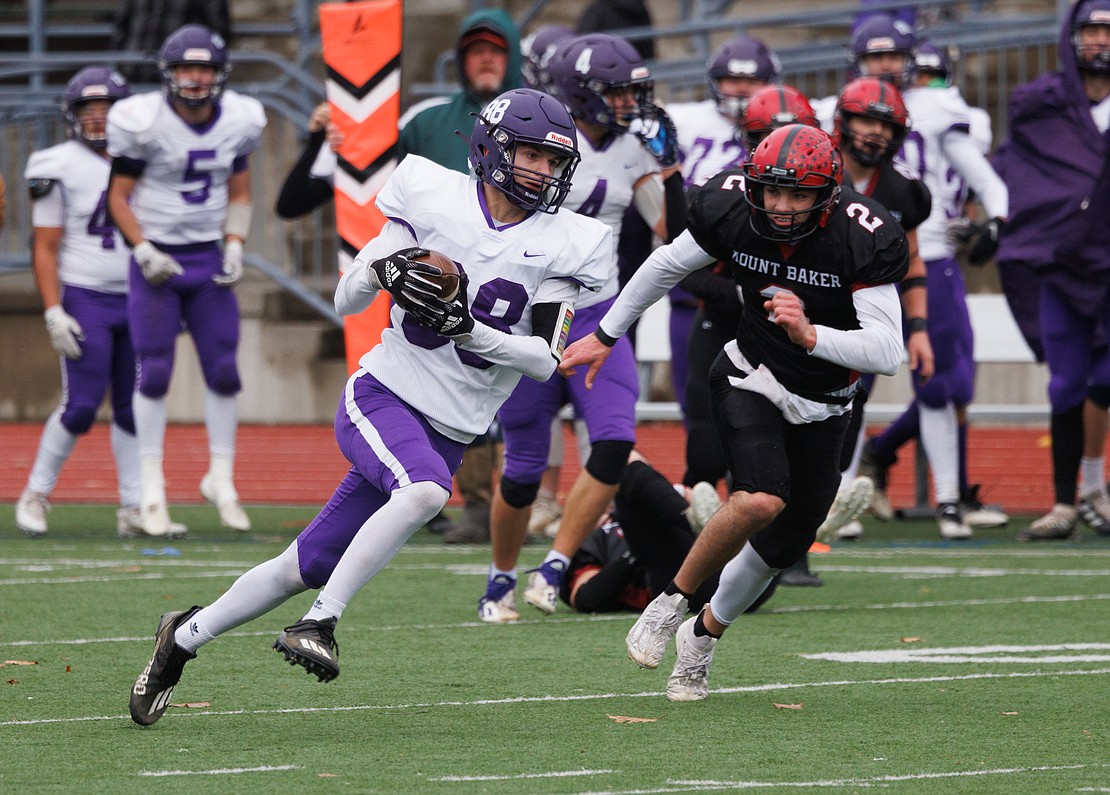 Nooksack Valley's Bennett DeLange runs for a 47-yard touchdown to put the Pioneers up 13-7 in the second quarter.