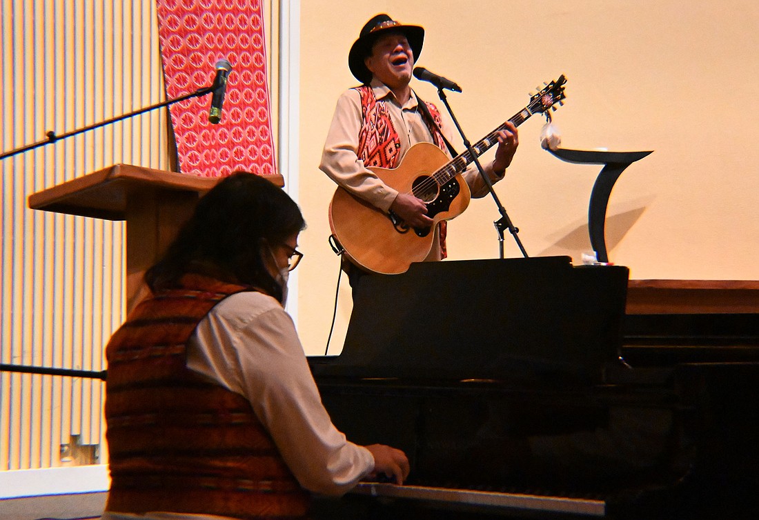 J. P. Falcon Grady, a self-taught guitarist, performs with Cindy Minkler at the Bellingham Unitarian Fellowship on Nov. 25. Grady, a member of the Piikani (Blackfeet) Nation, performs all along the West Coast either solo or with his band, the J.P. Falcon Band.