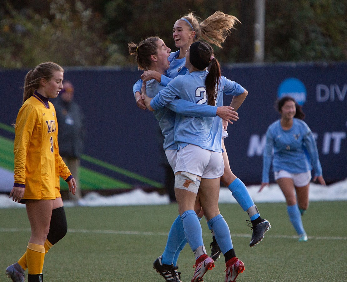 Western players hug Tera Zierner following her goal in the 14th minute.