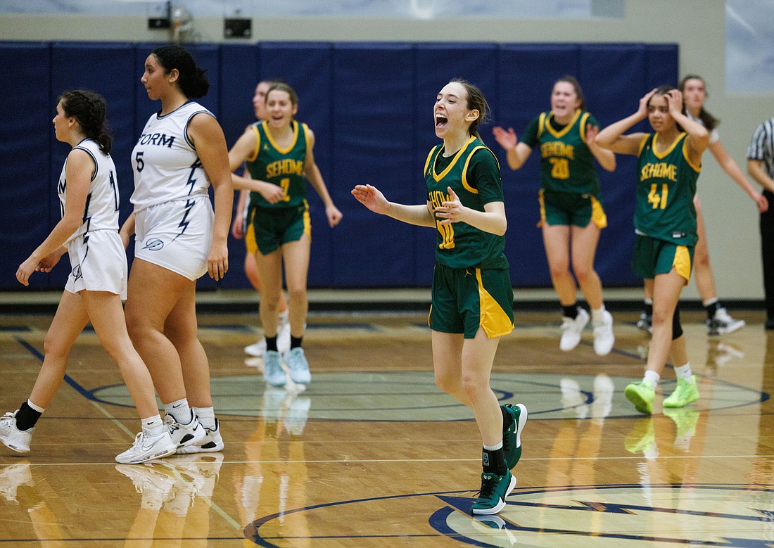 Sehome’s Emmy Hart, center, and her teammates react in joy and surprise on a come-from-behind win with less than a minute left in the game over Squalicum, winning 46-42 on the road Dec. 5.