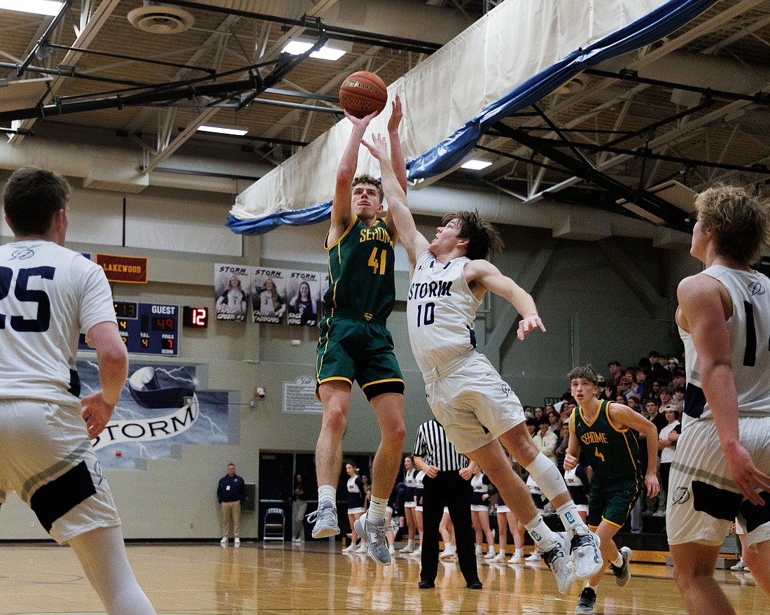 Sehome’s Grant Kepley hits a jump shot against Squalicum in the fourth quarter as the Mariners downed the Storm 57-35 on Dec. 5.