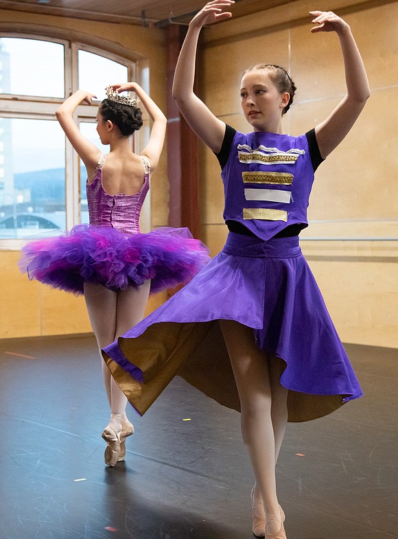 Emery Ewing as the Nutcracker, right, and Jina Thomson as the Sugar Plum Fairy dance together.