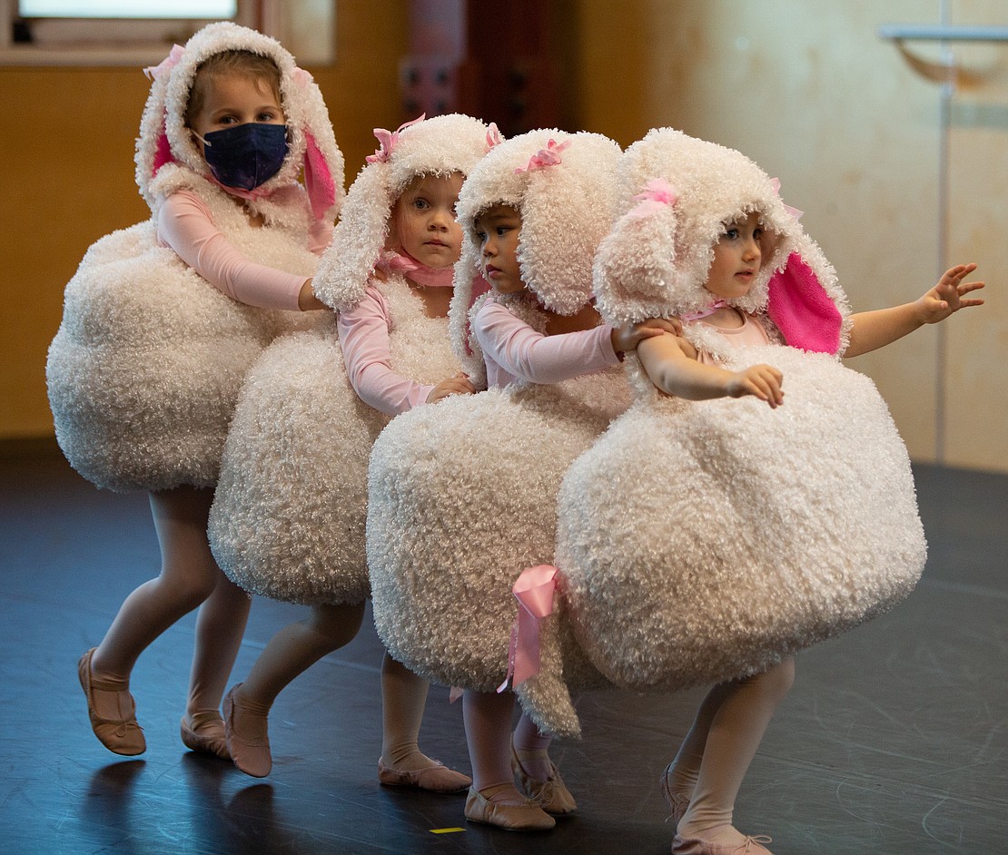 Marshmallow sheep – a group of Opus' youngest performers – find their way around stage.