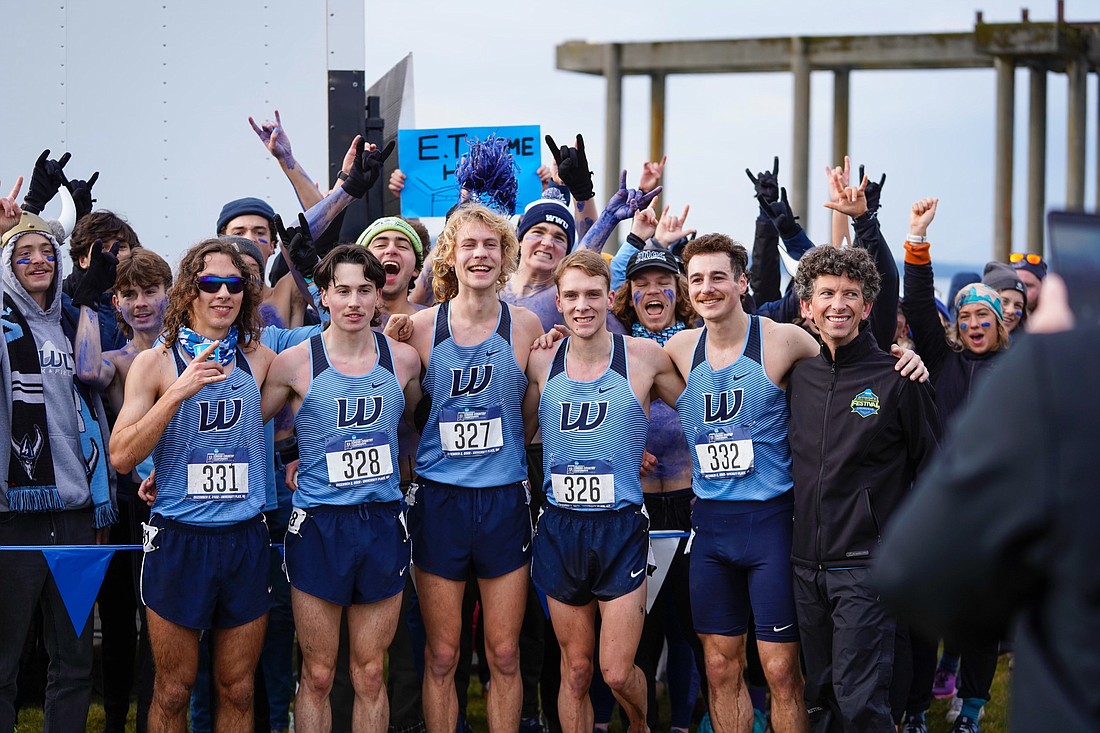 From left, Western Washington University runners Andrew Oslin, Jalen Javurek, Jeret Gillingham, Ryan Clough and Alec Ritter pose with assistant coach T.J. Garlatz following the men's 10,000-meter race at the NCAA Division II National Championships on Dec. 2.