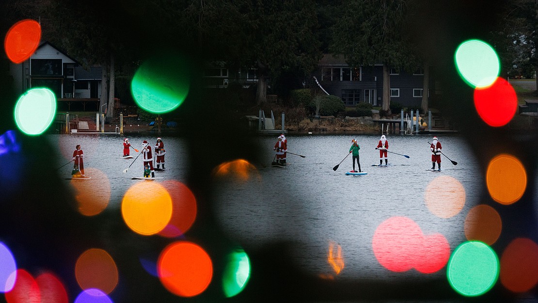 Sixteen standup paddleboarders donned Christmas outfits and paddled on Lake Samish  on Dec. 10.