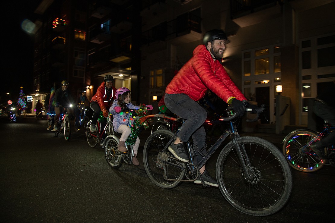 With lights and holiday decorations, riders head for Boulevard Park.
