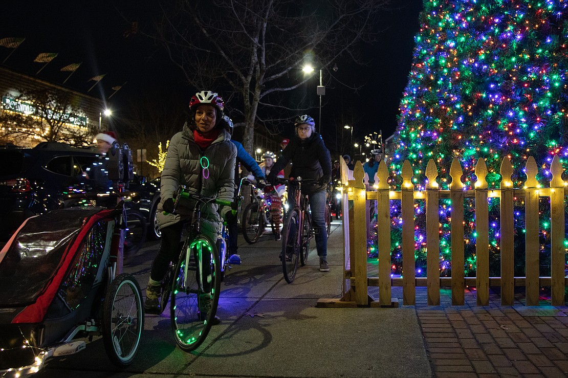 The Lighted Bike Parade begins with a pass by a Christmas tree.