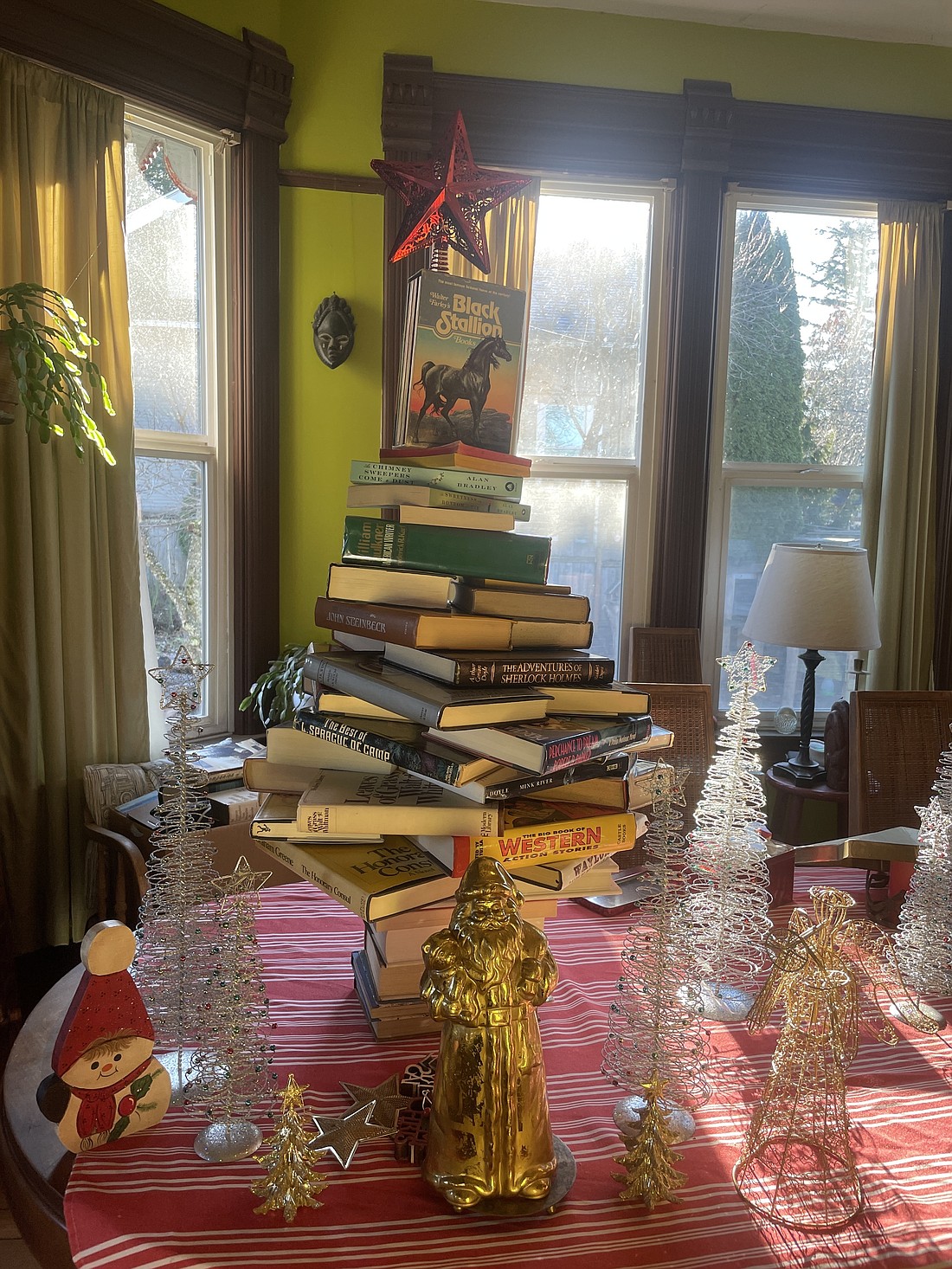 If you're looking to give the gift of reading this year, suggestions from local librarians and booksellers will guide the way. If you have so many books in your house you can make a Christmas tree out of them, consider giving some of your favorites as gifts to clear out bookshelf space.