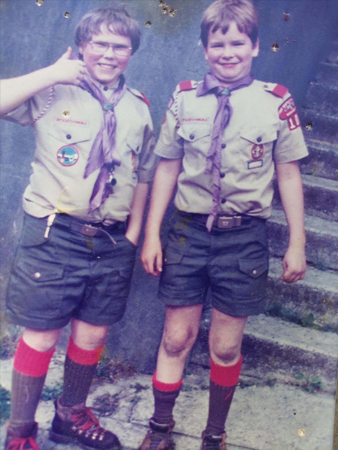 Scott Fairbanks, left, and Jason D. Martin in the early 1980s after a successful — but very dirty — camping trip. Fairbanks died shortly before the pandemic at the age of 47. He shared Martin's opinion that being a scout made him who he was.