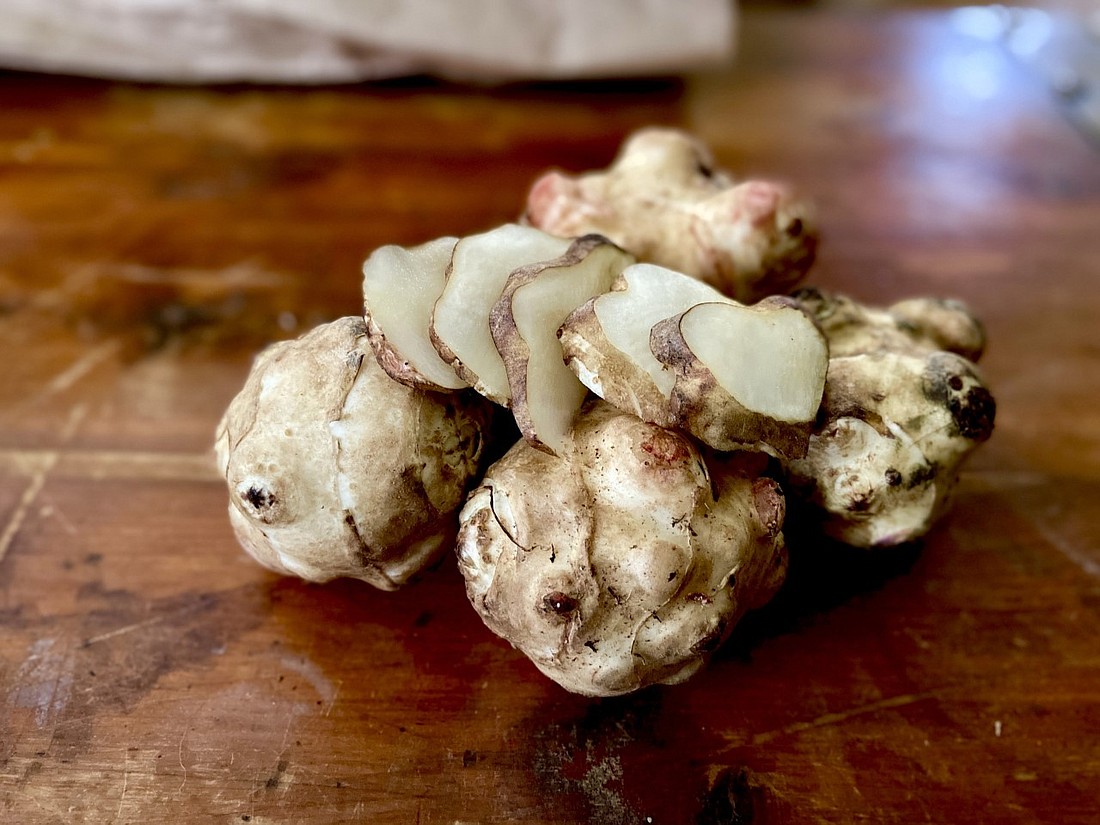 Our root-to-leaf ingredient this month is sunchoke, a mellow root vegetable that belongs to the sunflower family. In this recipe, the simmered vegetable and roasted garlic are flavored with nutmeg and combined with ricotta to make sunchoke and roasted garlic ravioli.