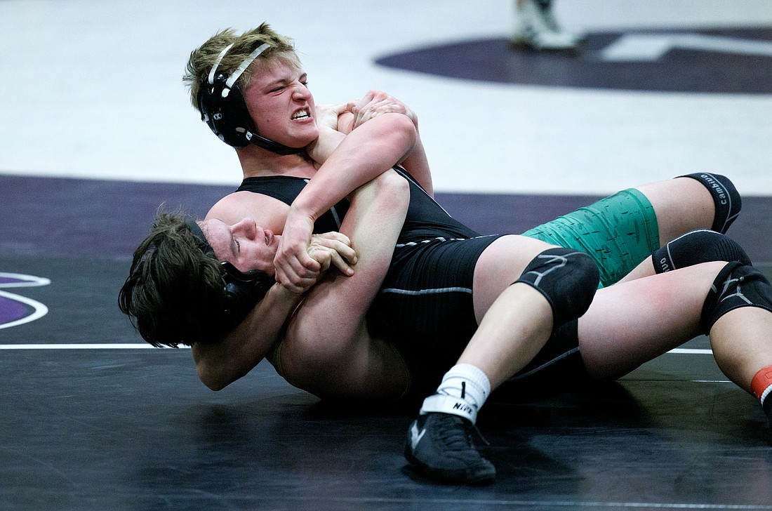 Lynden's Charles Jenkins pins Meridian's Landon Downey during a wrestling meet on Jan. 4, hosted by Nooksack Valley.