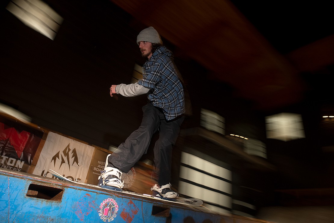 Michael Buckley grinds on the 18-foot flatbox during Boardworks Tech Shop Box Jam 8 at Time and Materials Taphouse Jan. 14. Buckley, who moved to Bellingham from Ireland when he was 12, has been snowboarding for four years.