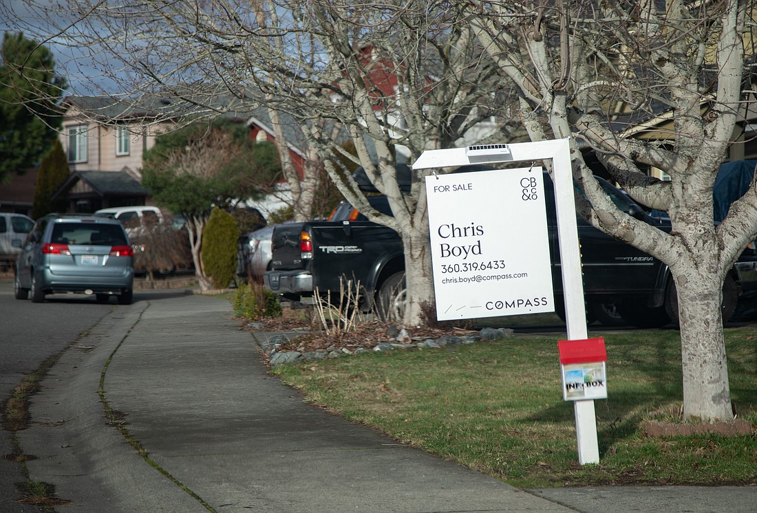 A "For Sale" sign is posted outside a home in the King Mountain neighborhood. Bellingham had the highest median selling price in Whatcom County in 2022, up 13% from 2021.