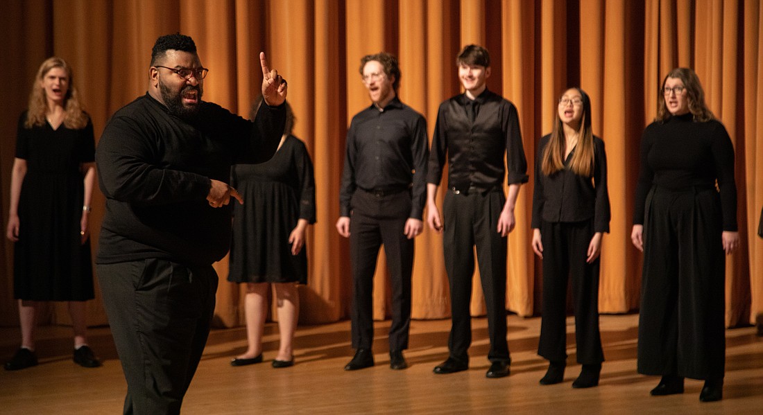 Richard Hodges, director of voice studies, conducts the Western Washington University concert choir as they sing "Poor Man Lazarus" during a Martin Luther King Jr. Day event on Jan. 16.