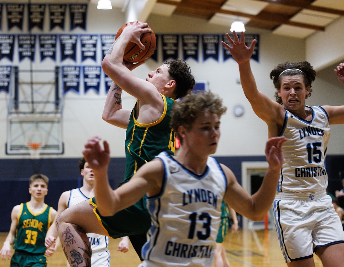 Sehome's Matt Storms blasts past the Lyncs' defense for two points as Sehome beat defending 1A state champion Lynden Christian 76-64 on Jan. 19.