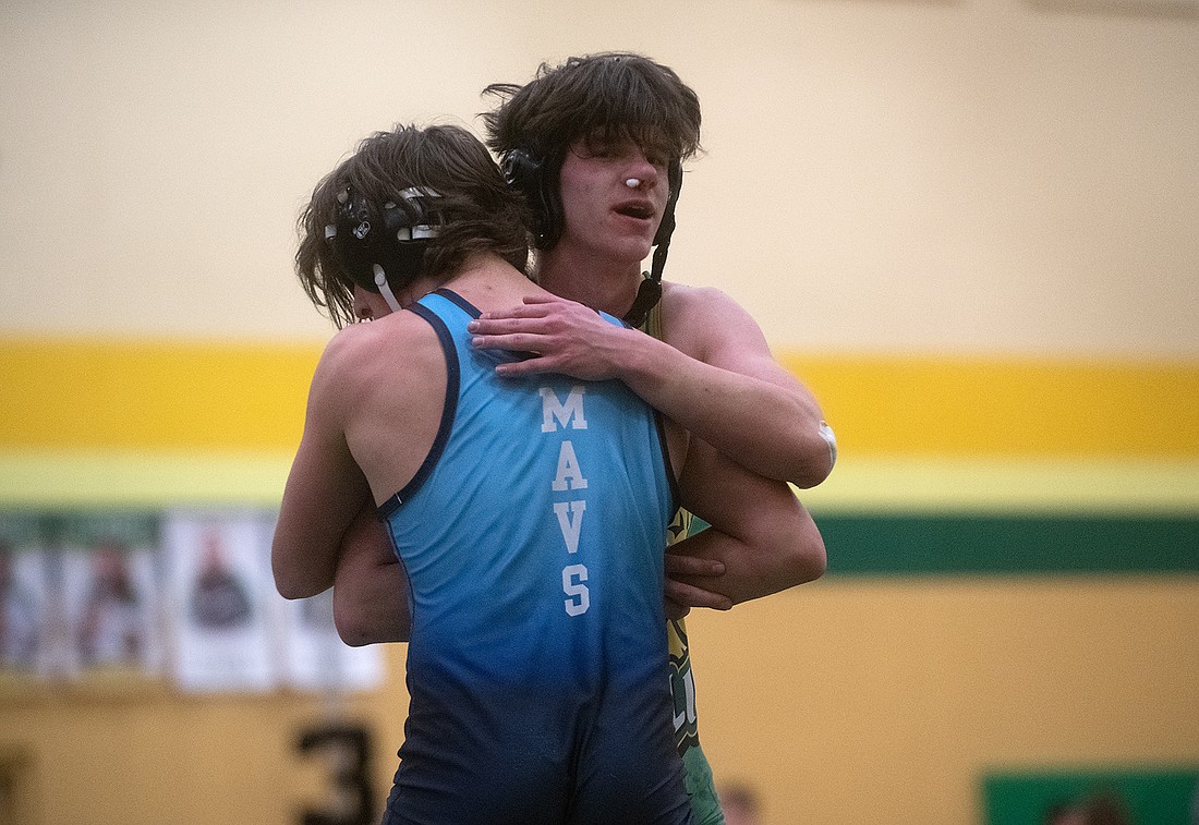 Lynden's Charlie Jenkins hugs Meadowdale's Jackson Zollars after a close match. Jenkins beat Zollars 8-7 during the Lynden Wrestling Tournament on Jan. 21.