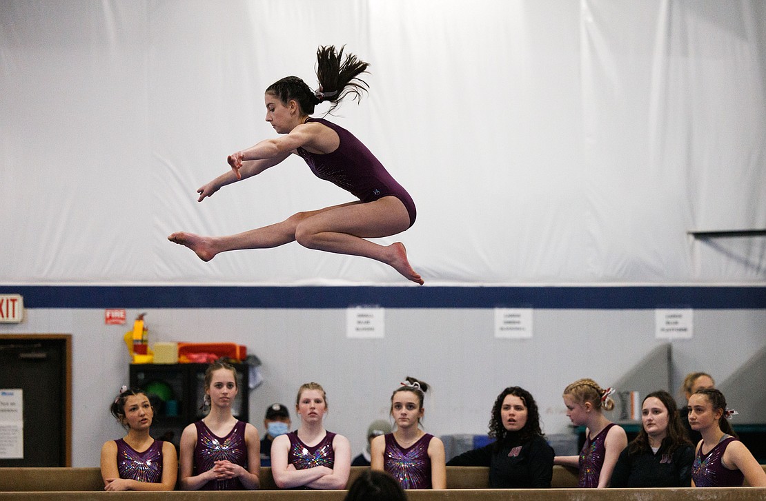 Bellingham United Gymnastics’ Elizabeth Comeau leaps on the balance beam Jan. 29 during competition at North Coast Gymnastics Academy. The team is made up of students from Bellingham, Squalicum and Sehome High.