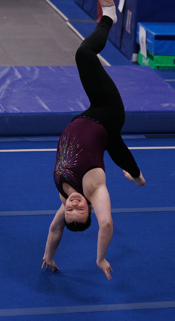 The Bellingham United Gymnastics’s Victoria Neufeld performs on the floor as the team competes against Ballard and Nathan Hale high schools.
