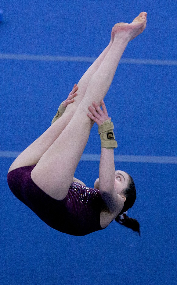 Bellingham United Gymnastics’ Elizabeth Comeau does a front pike during the floor competition at North Coast Gymnastics Academy. Comeau took third place in the event.