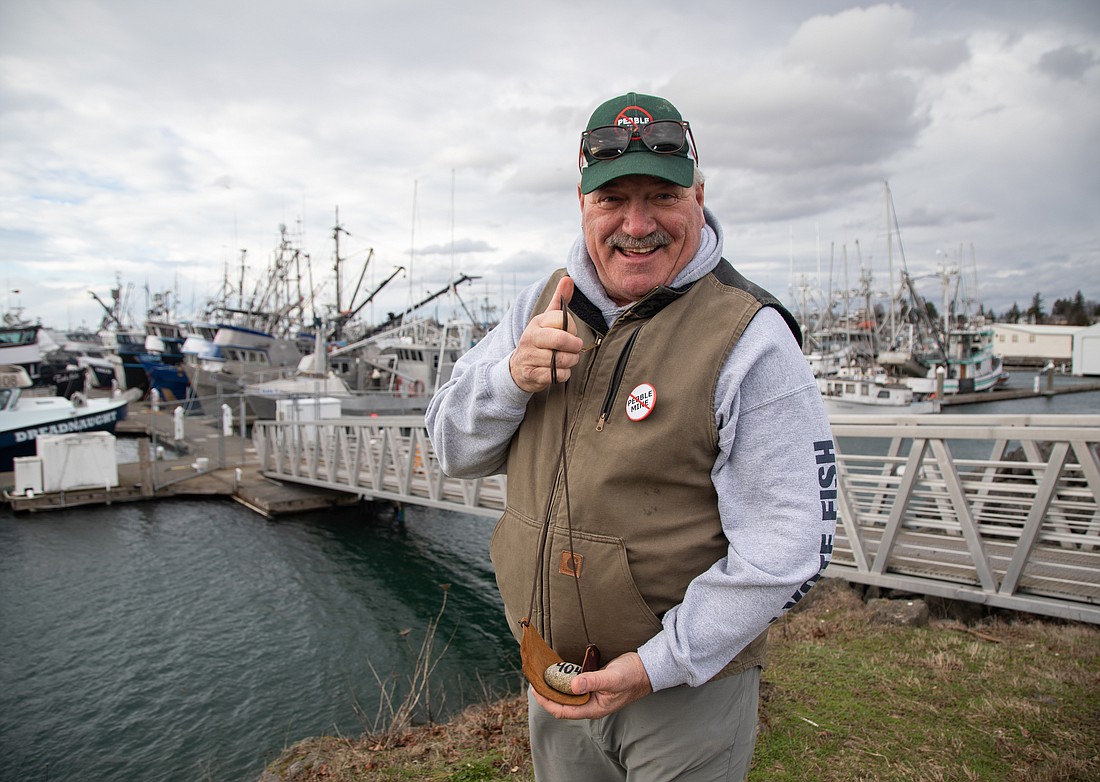 Michael Jackson stands at Squalicum Harbor, donning anti-Pebble Mine gear. Jackson is a Bellingham-based fisherman and the president of the Bristol Bay Regional Seafood Development Association. He has advocated against the mine for more than a decade.