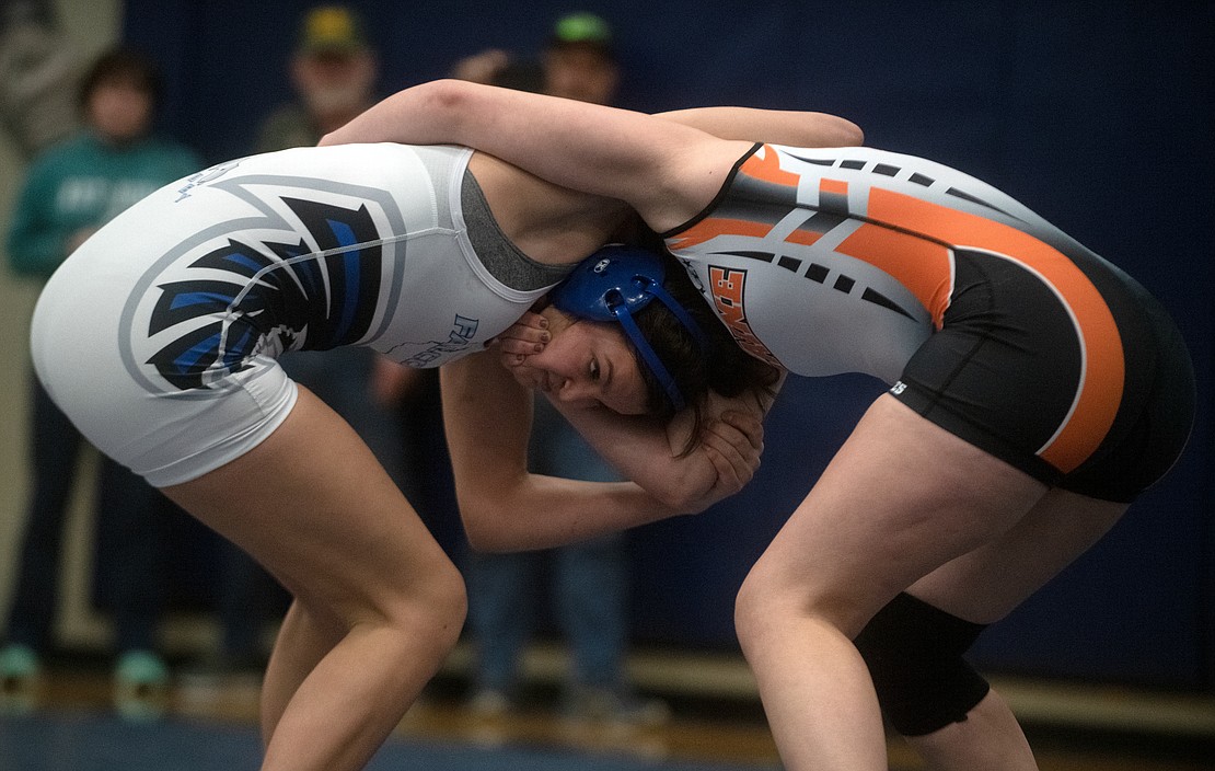 South Whidbey's Kaylie Baker, left, and Blaine's Lucyanna Dahl fight for control during the 145-pound first-place match. Baker won by 7-4 decision.