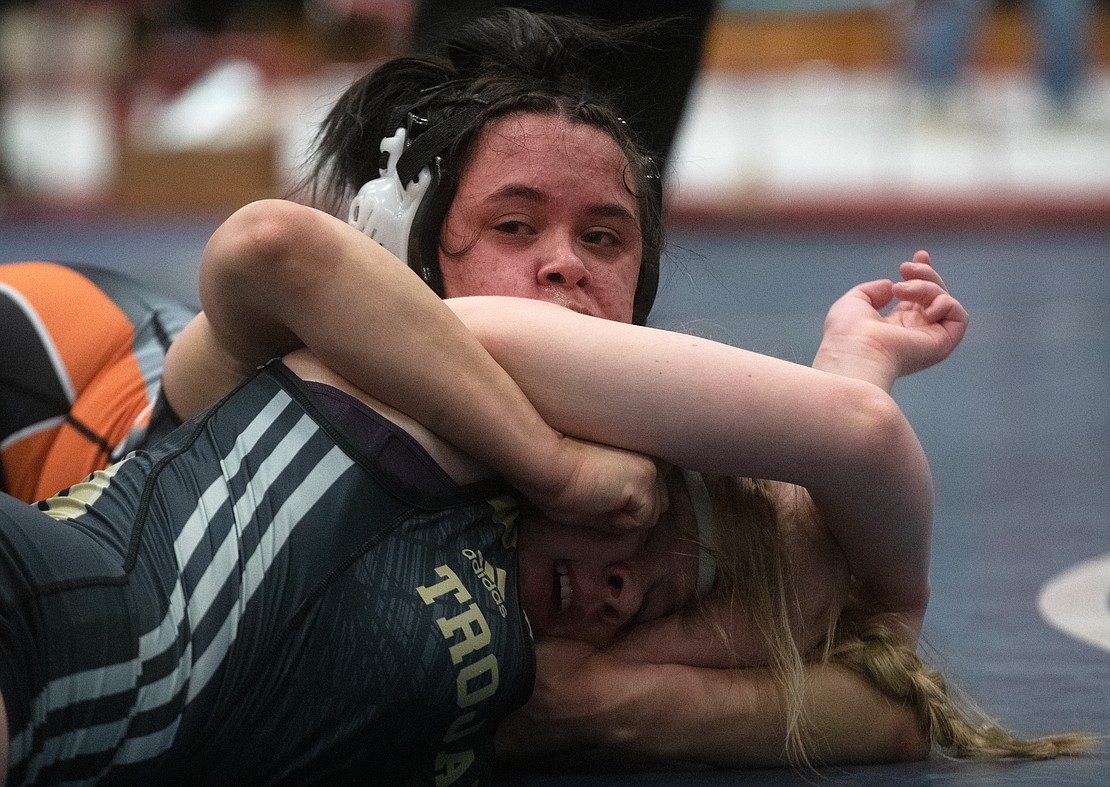 Meridian's Madison Brzozowski, right, escapes the grip of Blaine's Analicea Ordonez in the 155-pound third-place match. Brzozowski won by 8-0 major decision.