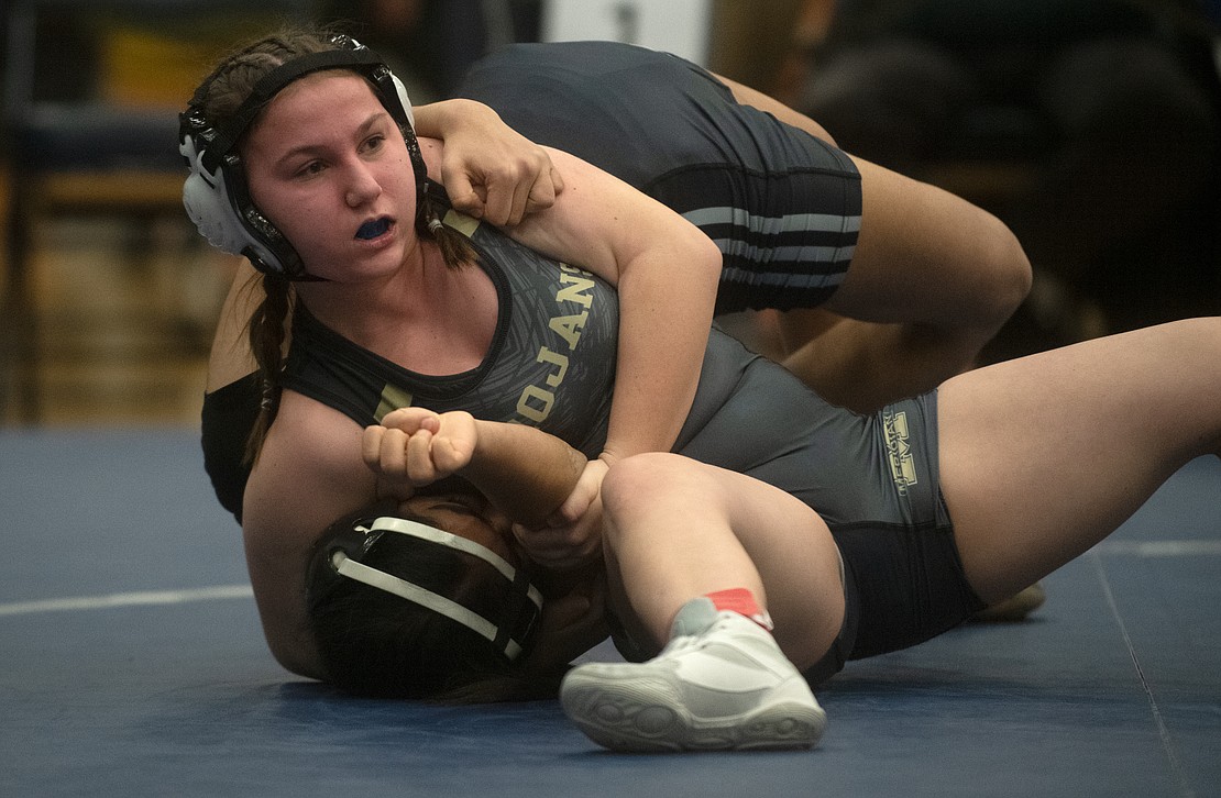 Meridian's Hailey Horsman locks Meridian's Sukhpreet Kaur head and arm in the 120-pound third-place match. Horsman won by pin in 28 seconds.