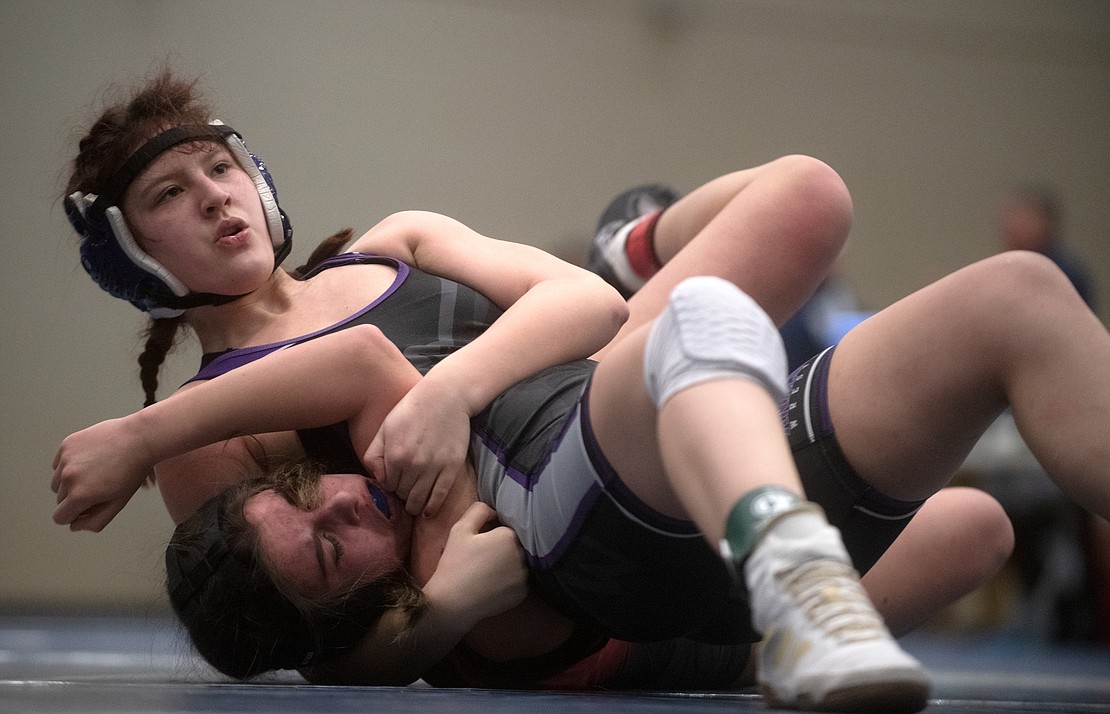 Alita Ciron-penton of Anacortes takes an early lead against Mount Baker's Melanie Wilson in the 140-pound third-place match. Wilson would come back to pin Ciron-penton in 4:37.