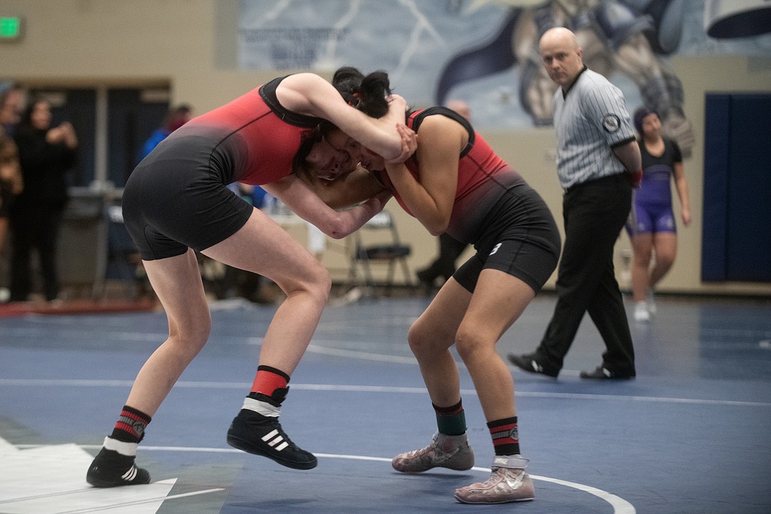 Mount Baker's Karalyn Cook and Ana Camacho compete against one another in the 110-pound first-place match.