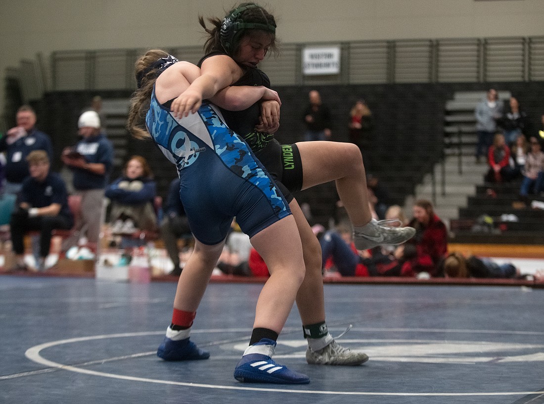 Sultan's Liberty Rose lifts Lynden's Gabriella Briceno Feb. 4 during the 140-pound fifth-place match at the 1B/2B/1A/2A North Sub-Regional Girls Wrestling Tournament at Squalicum High School. Rose pinned Briceno in 3:10.