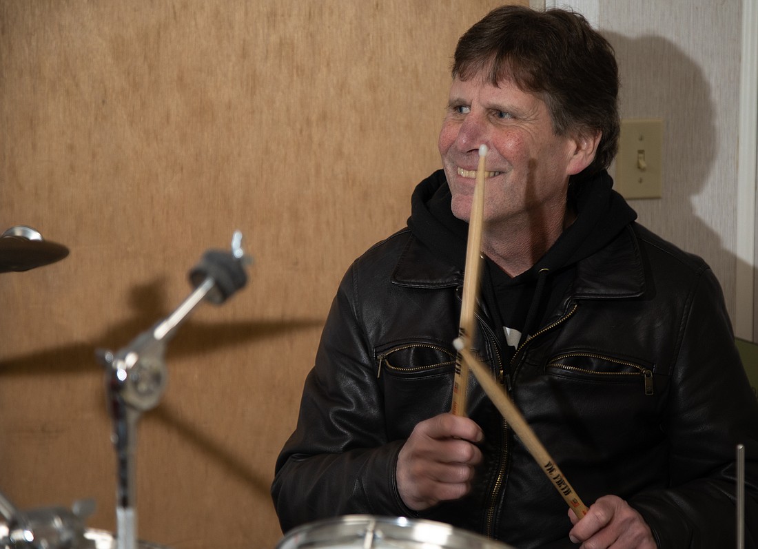 Jud Sherwood plays drums in his Bellingham home studio Feb. 10. Sherwood has directed The Jazz Project for 25 years.