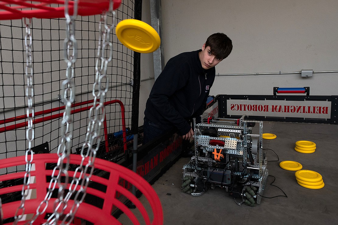 Freshman Alden Bachmeier tests the shooting distance Feb. 8 while writing the code for the autonomous challenge at Bellingham High School.
