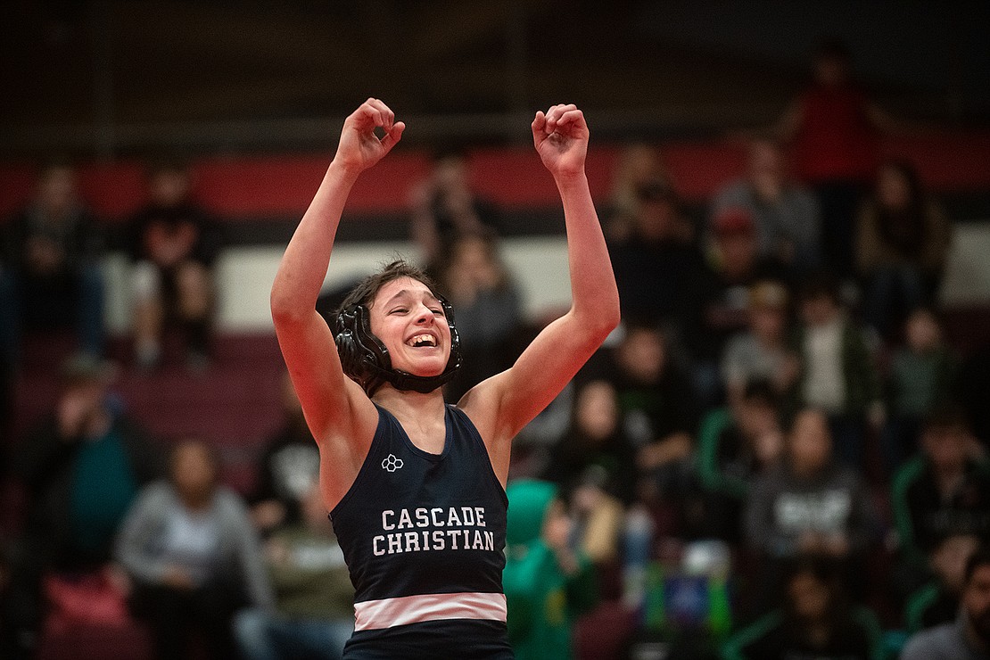 Cascade Christian's Aiden Kucera celebrates defeating Granite Falls' Nathan Phillips in the semi-final round of the 106-pound weight class.