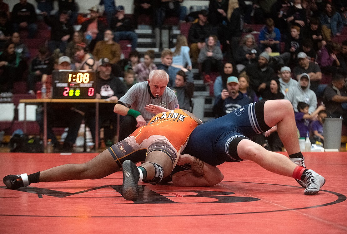 Blaine's Rahul Chandran pins Caleb Harris of Cascade Christian in the semi-final round of the 220-pound weight class.