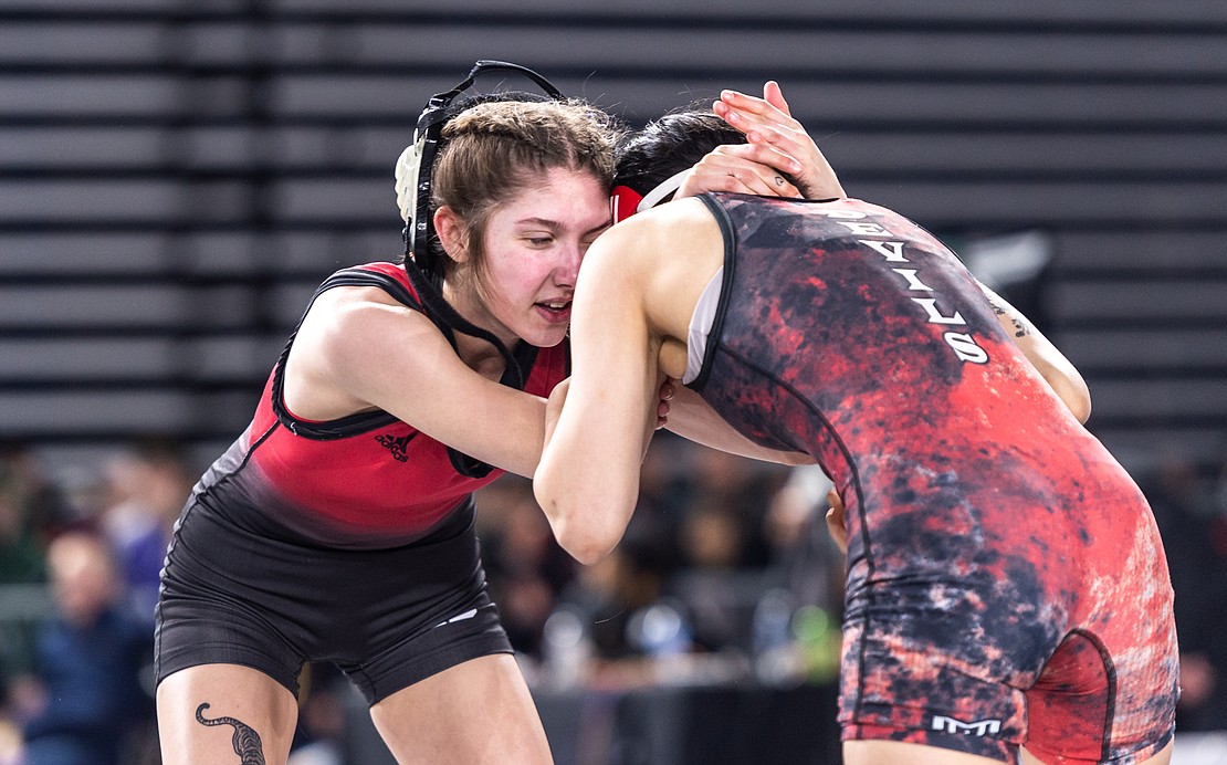 Mount Baker’s Ella Moa, 100 pounds, competes against East Valley’s Emily Garcia in the first round.