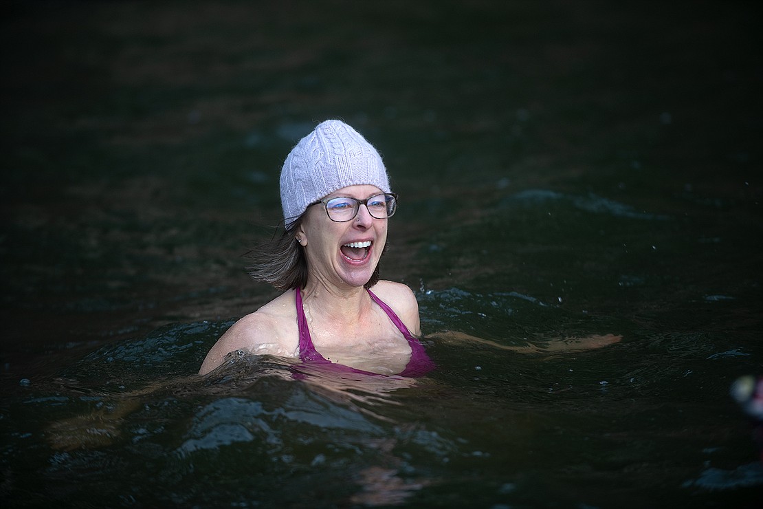 Jen Andrews screams while swimming in the chilly waters of Lake Padden Feb. 3.