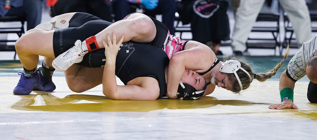 Bellingham United’s Isabella Phillips tries to avoid the pin by Marysville-Pilchuck’s Alivia White in their championship match. White pinned Phillips in the first period.
